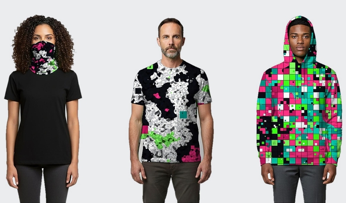 The image shows three individuals standing against a plain white background. On the left, a woman is wearing a black t-shirt and a face mask with a floral pattern. In the center, a man is wearing a black t-shirt with a white and black abstract pattern and a pink and green geometric design. On the right, a man is wearin